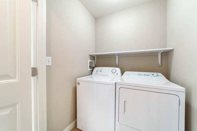 laundry room with independent washer and dryer