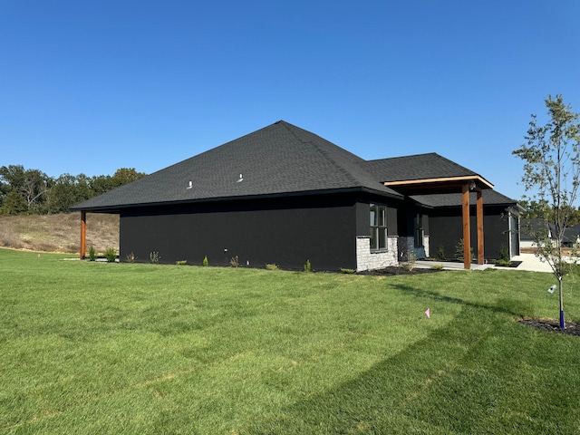 view of home's exterior featuring a yard