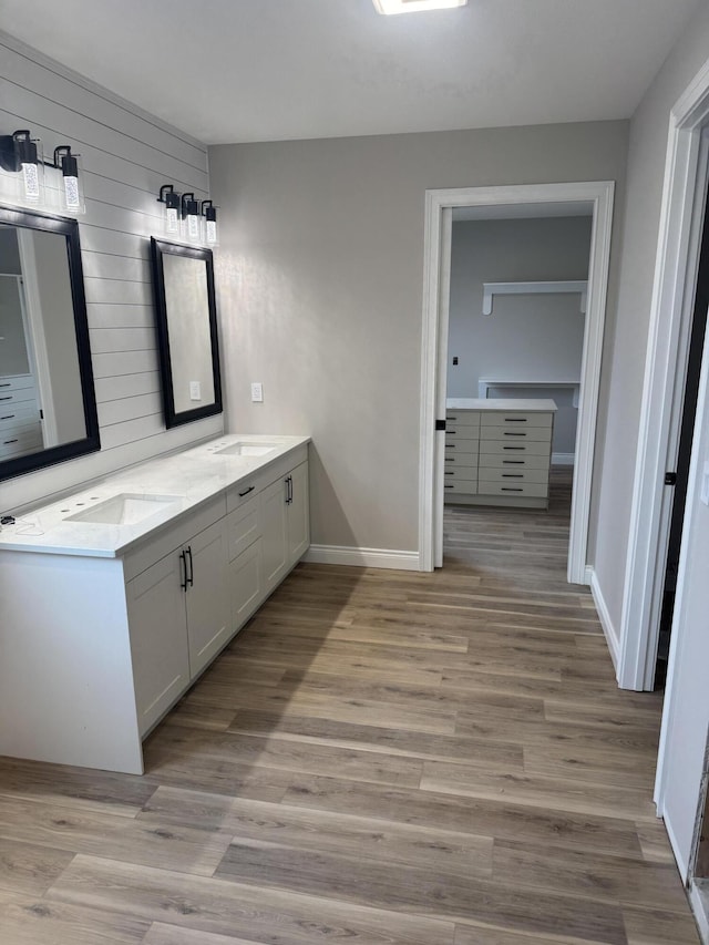 bathroom featuring vanity and hardwood / wood-style flooring