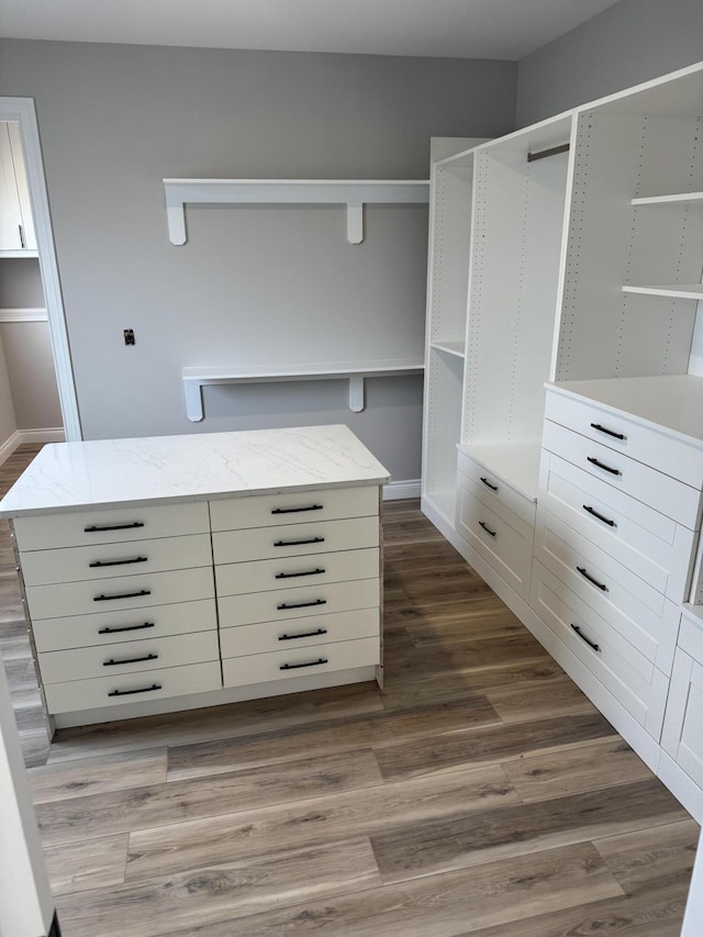 walk in closet featuring hardwood / wood-style flooring