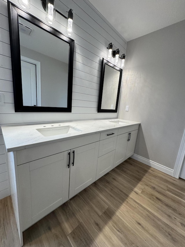 bathroom with vanity and hardwood / wood-style floors