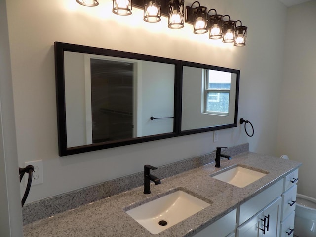 14 Carnival Ln, Centralia, MO 65240 - bathroom featuring double vanity and toilet