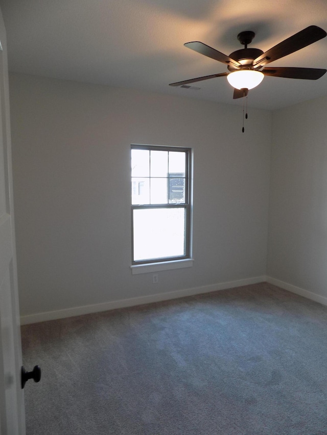 14 Carnival Ln, Centralia, MO 65240 - carpeted spare room featuring baseboards and ceiling fan