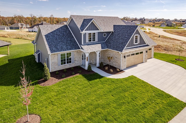 view of front of property with a garage and a front lawn