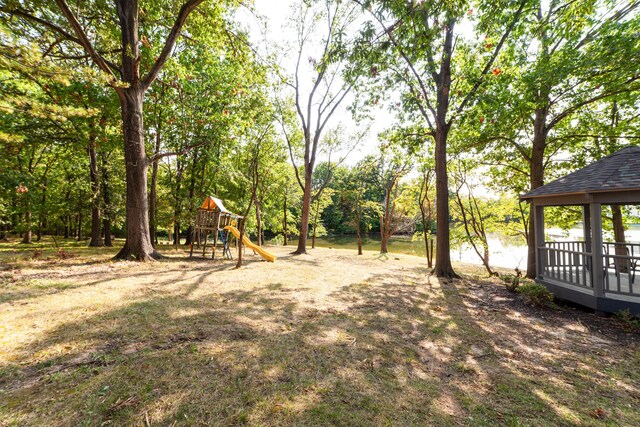 view of yard with a gazebo and a playground