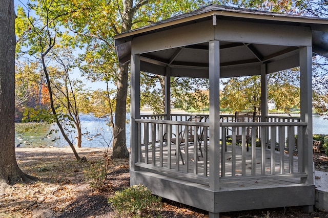 deck with a gazebo and a water view