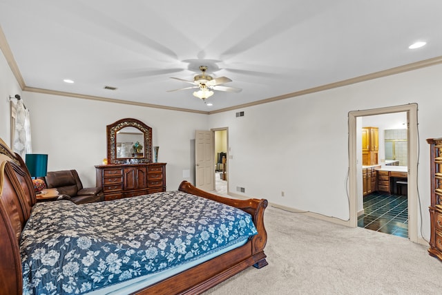 carpeted bedroom featuring ceiling fan, crown molding, and ensuite bathroom