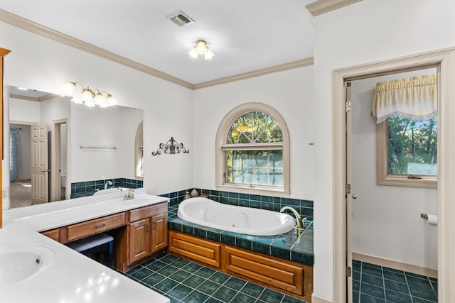 bathroom featuring a bathtub, ornamental molding, tile patterned flooring, and vanity