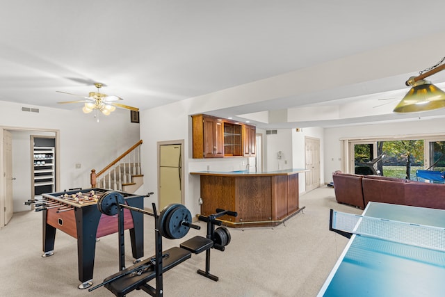 playroom with light carpet and ceiling fan