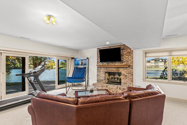 living room with light carpet and a brick fireplace