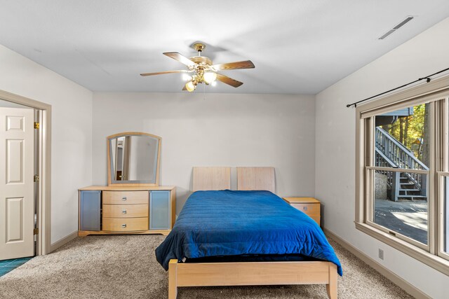 carpeted bedroom with ceiling fan