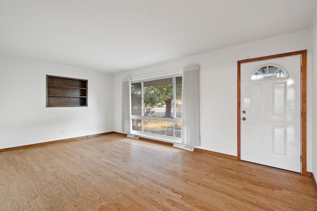 foyer with light hardwood / wood-style floors