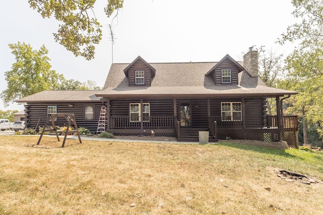 view of front of property with a front lawn and covered porch