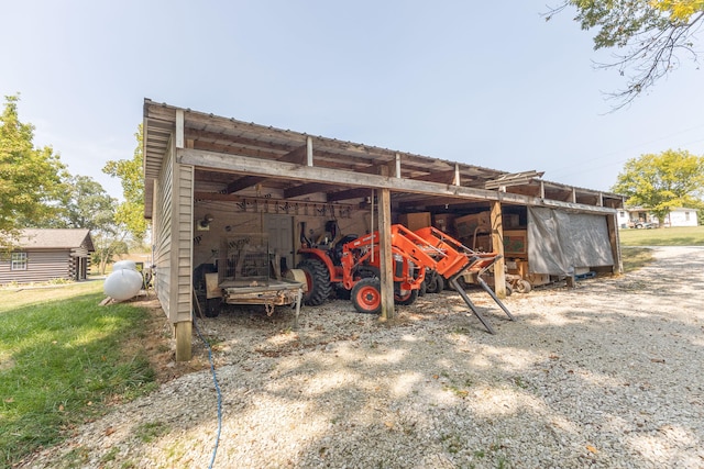 view of outbuilding featuring a yard