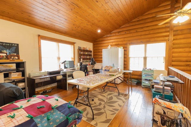 home office featuring plenty of natural light, lofted ceiling, hardwood / wood-style flooring, and ceiling fan