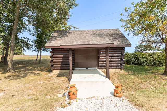 view of outbuilding with a yard