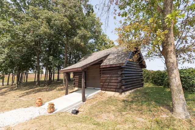 view of outdoor structure with a yard