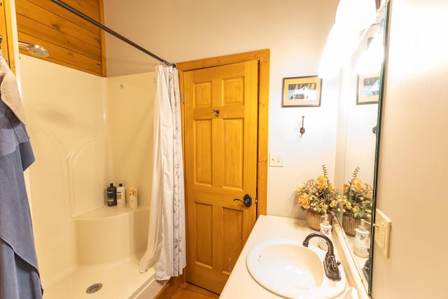 bathroom featuring vanity and walk in shower