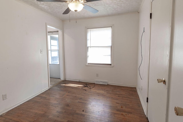 empty room with ceiling fan and dark hardwood / wood-style floors