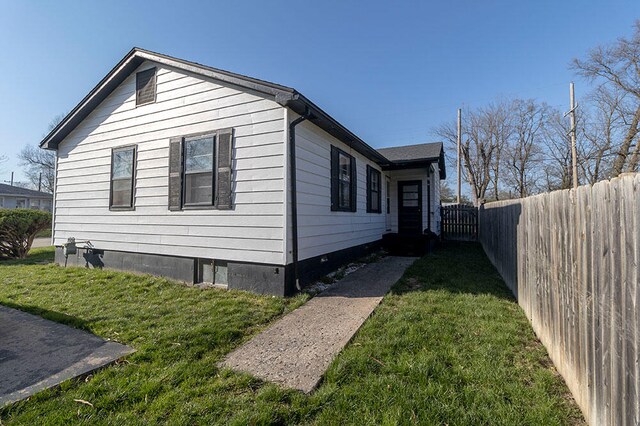 view of home's exterior featuring a yard