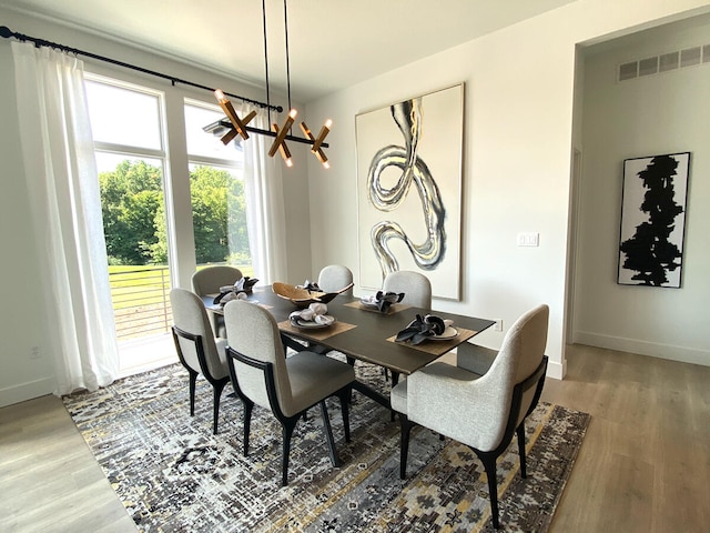 dining room featuring a chandelier and hardwood / wood-style flooring