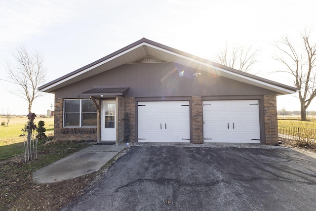 ranch-style home featuring a garage