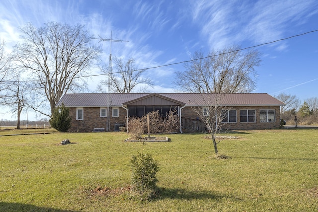 ranch-style home with a front lawn