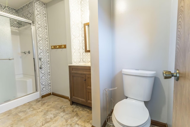 bathroom with vanity, toilet, and walk in shower