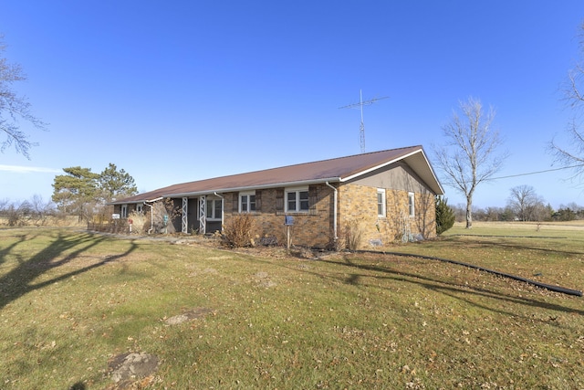 ranch-style home featuring a front yard