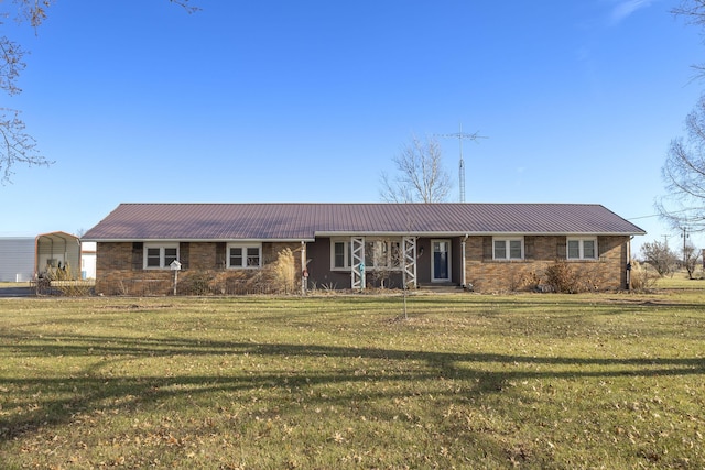 single story home featuring a front yard and a carport