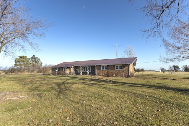 ranch-style home featuring a front yard