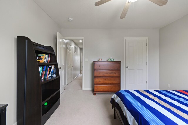 carpeted bedroom with ceiling fan