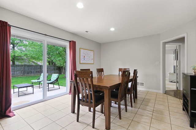dining area with light tile patterned floors, visible vents, and recessed lighting