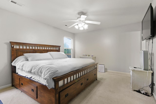 bedroom with light colored carpet, baseboards, and visible vents