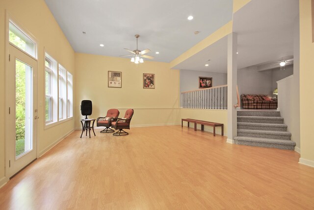 sitting room featuring light hardwood / wood-style flooring, ceiling fan, and vaulted ceiling