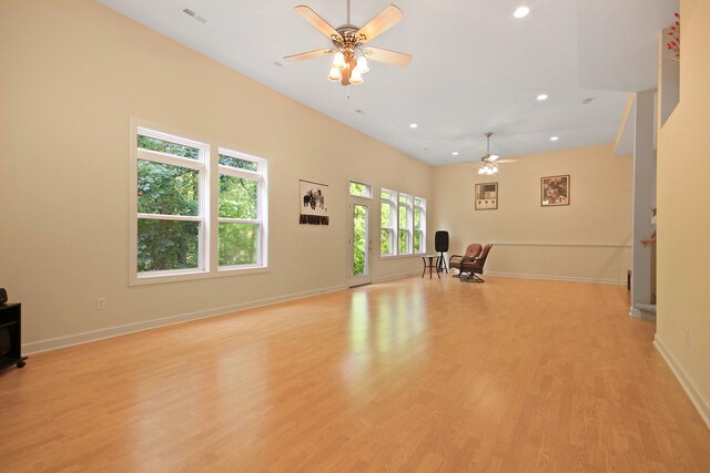 interior space with ceiling fan and light hardwood / wood-style floors