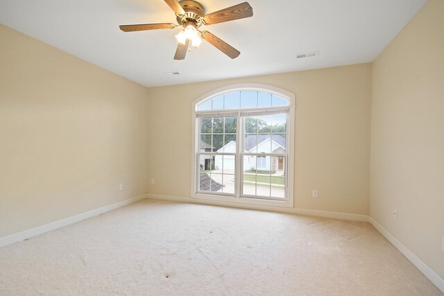 carpeted empty room with ceiling fan