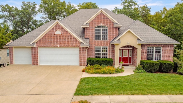 front of property featuring a garage and a front yard