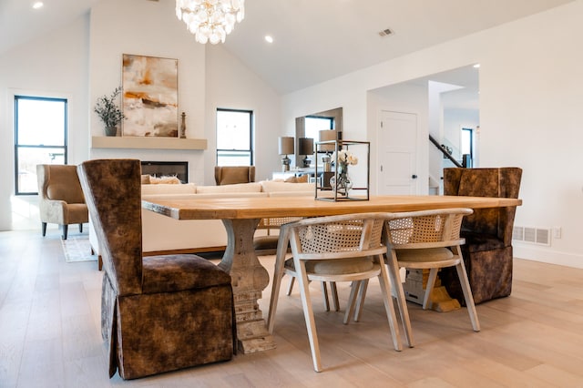 dining room with a chandelier, light hardwood / wood-style flooring, and plenty of natural light