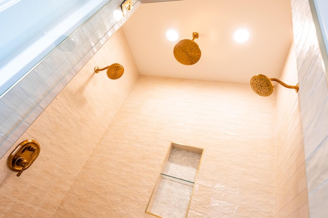 interior details featuring tiled shower