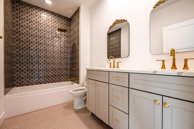 full bathroom featuring vanity, tiled shower / bath combo, toilet, and tile patterned flooring