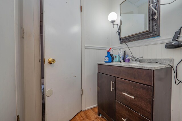 bathroom with vanity and hardwood / wood-style floors