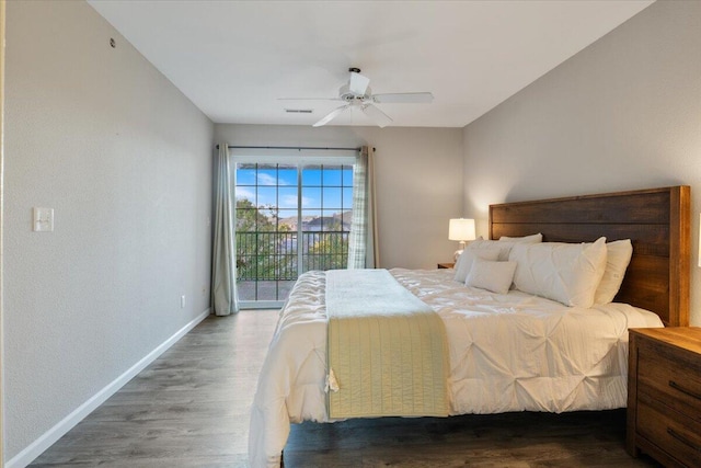 bedroom with ceiling fan, dark wood-type flooring, and access to exterior