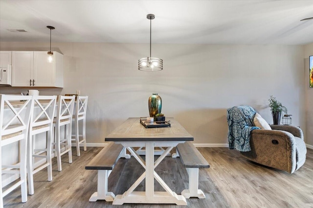 dining area featuring light wood-type flooring