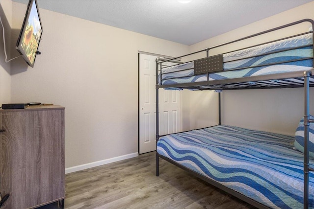 bedroom featuring hardwood / wood-style flooring