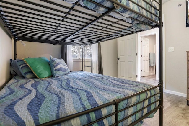 bedroom with wood-type flooring