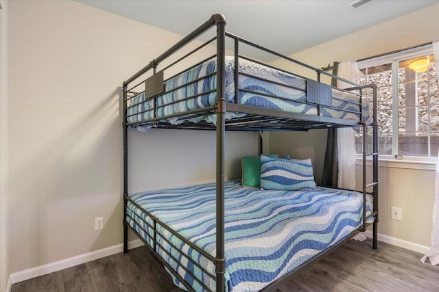 bedroom with wood-type flooring