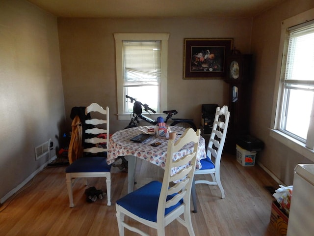 dining space featuring light wood-type flooring