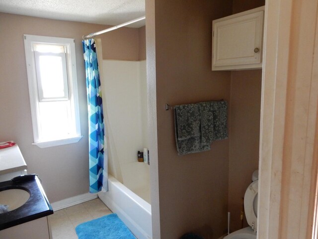 full bathroom with shower / tub combo, a textured ceiling, vanity, and toilet