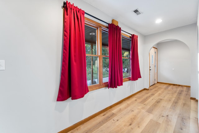 spare room featuring light hardwood / wood-style flooring